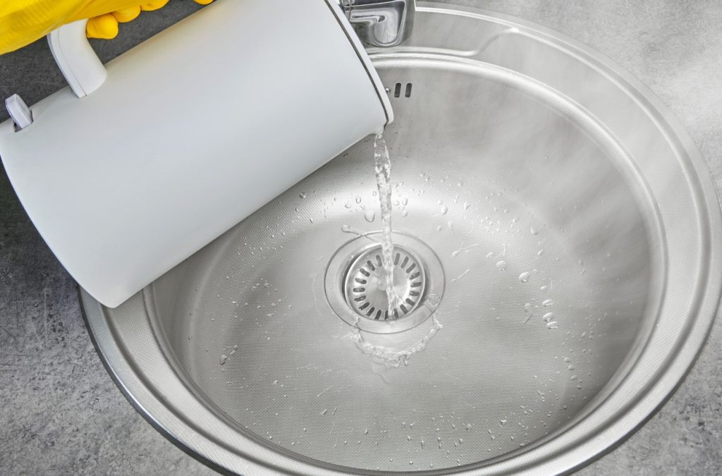 Pour boiling water down the drain