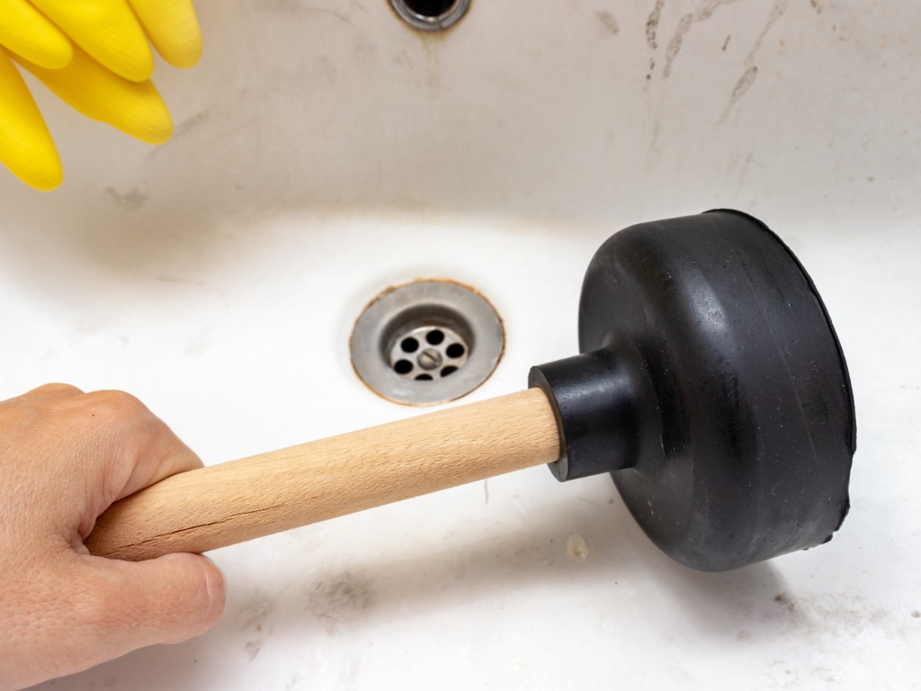 use plunger to unblock shower drain